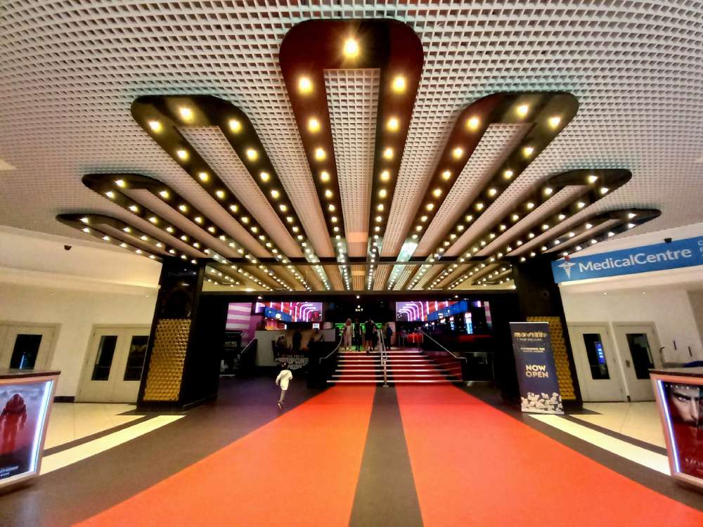 Image showcasing a well lit cinema lobby